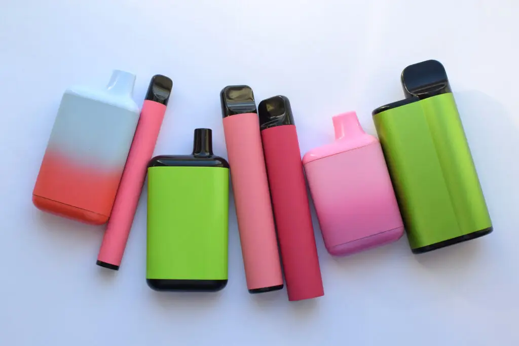 several-multicolored-electronic-cigarettes-lie-light-table-1